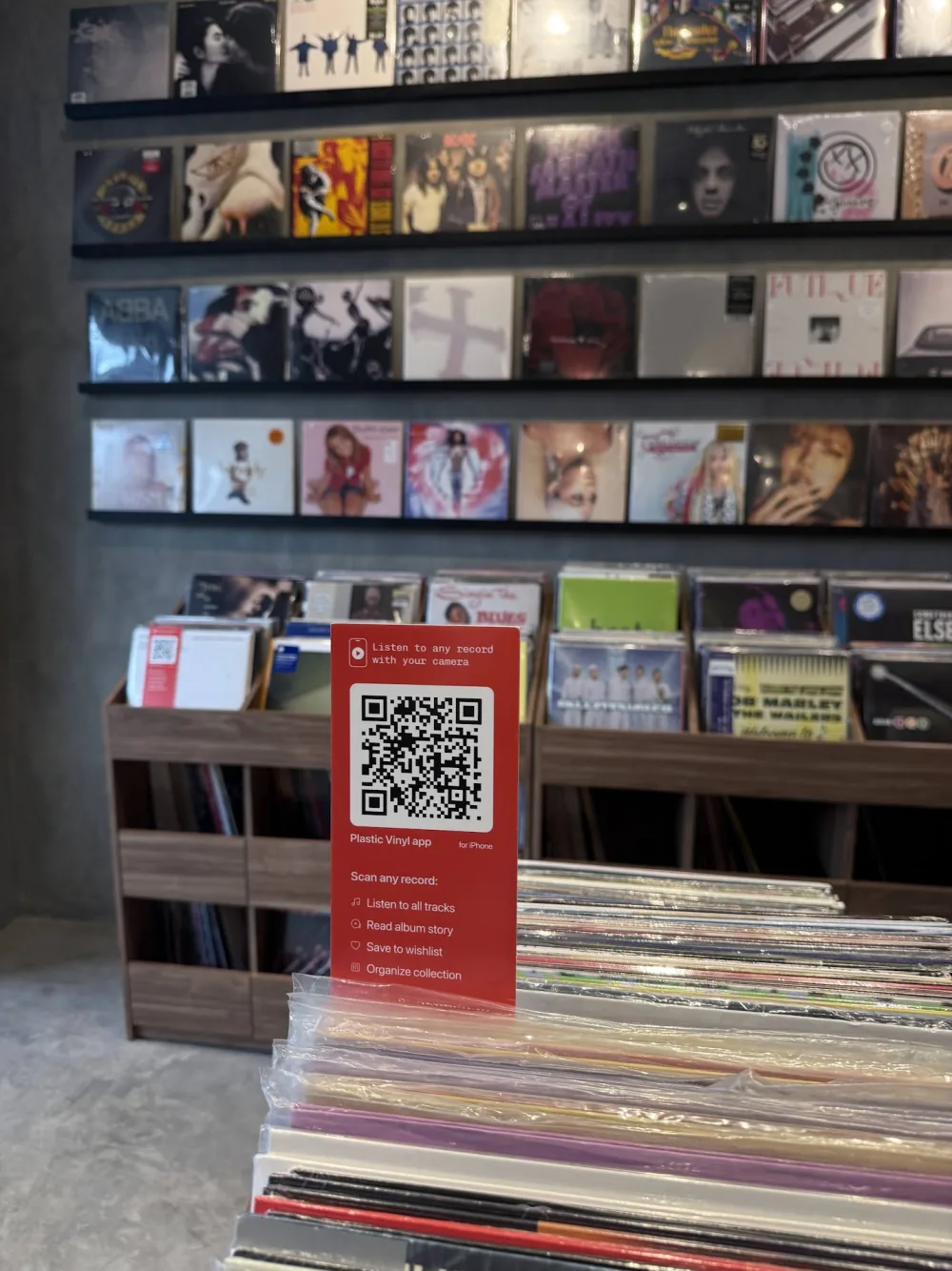 Plastic listening sign among records in a shop